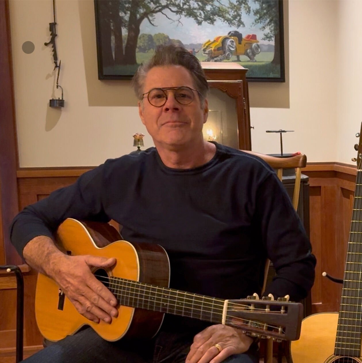 Robert Brighton with his acoustic guitar